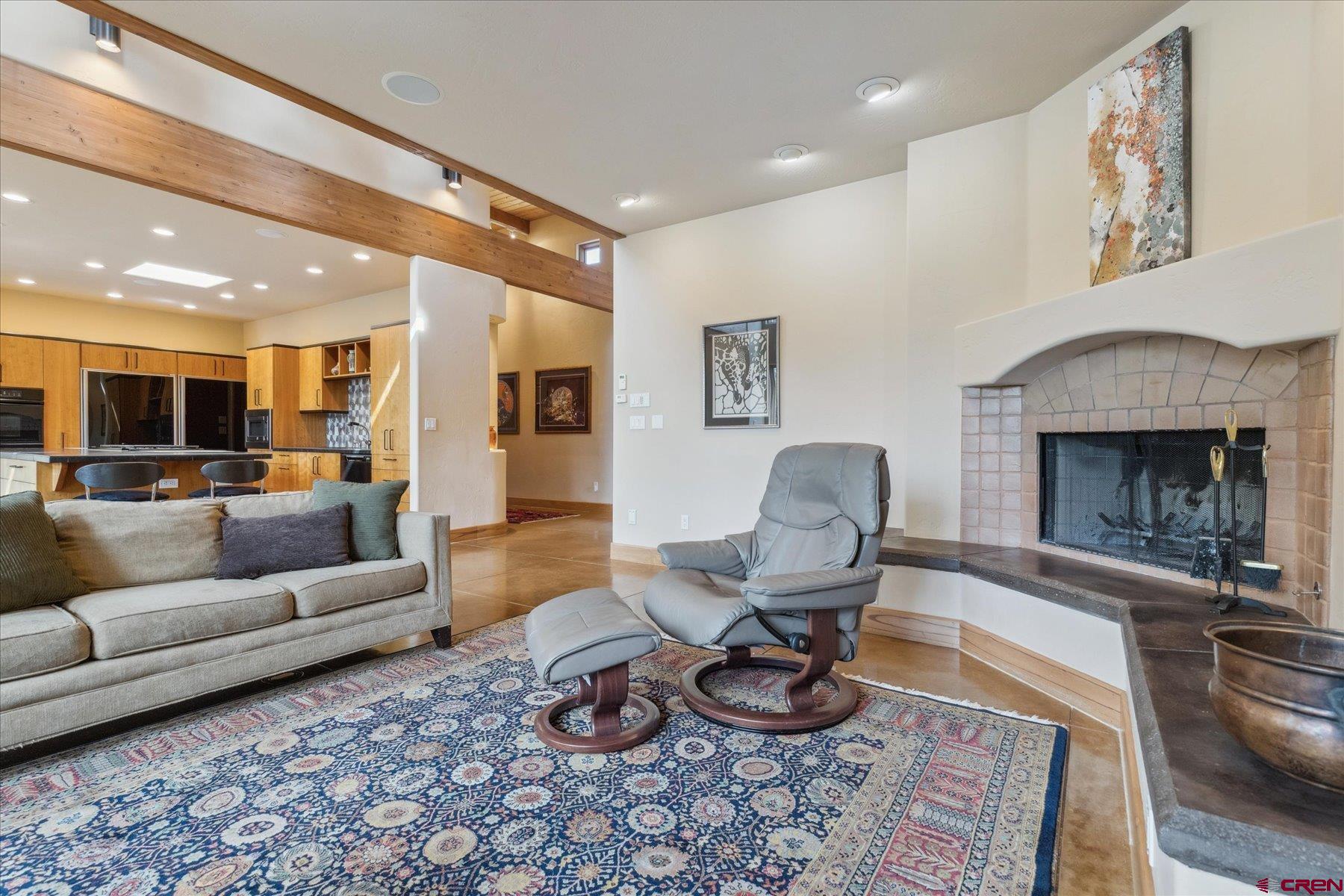 152 Peak Trail Drive Durango, CO 81303 - Photo 15 of 44 a living room with furniture and a fireplace