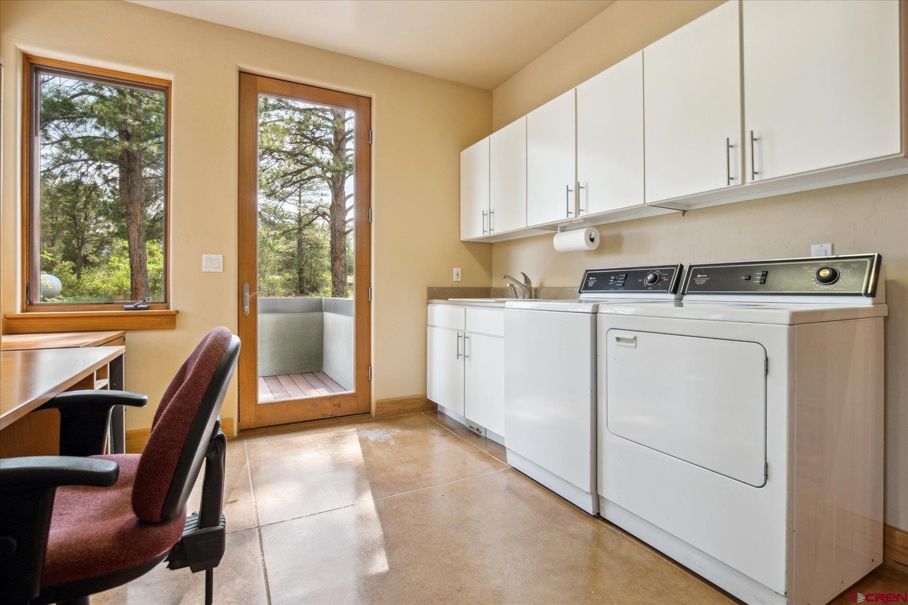 152 Peak Trail Drive Durango, CO 81303 - Photo 18 of 44 a view of a kitchen with cabinets and wooden floor