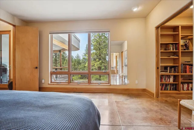 a room with a sink a toilet and a mirror