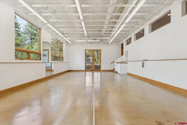 a view of a tiny house with a yard