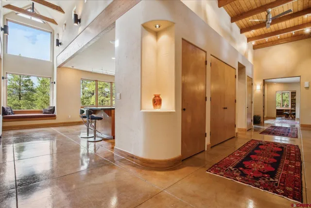 a very nice looking room with a large window and chair