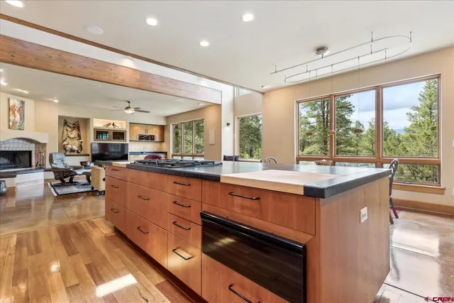 a open kitchen with stainless steel appliances granite countertop a lot of counter space and a sink