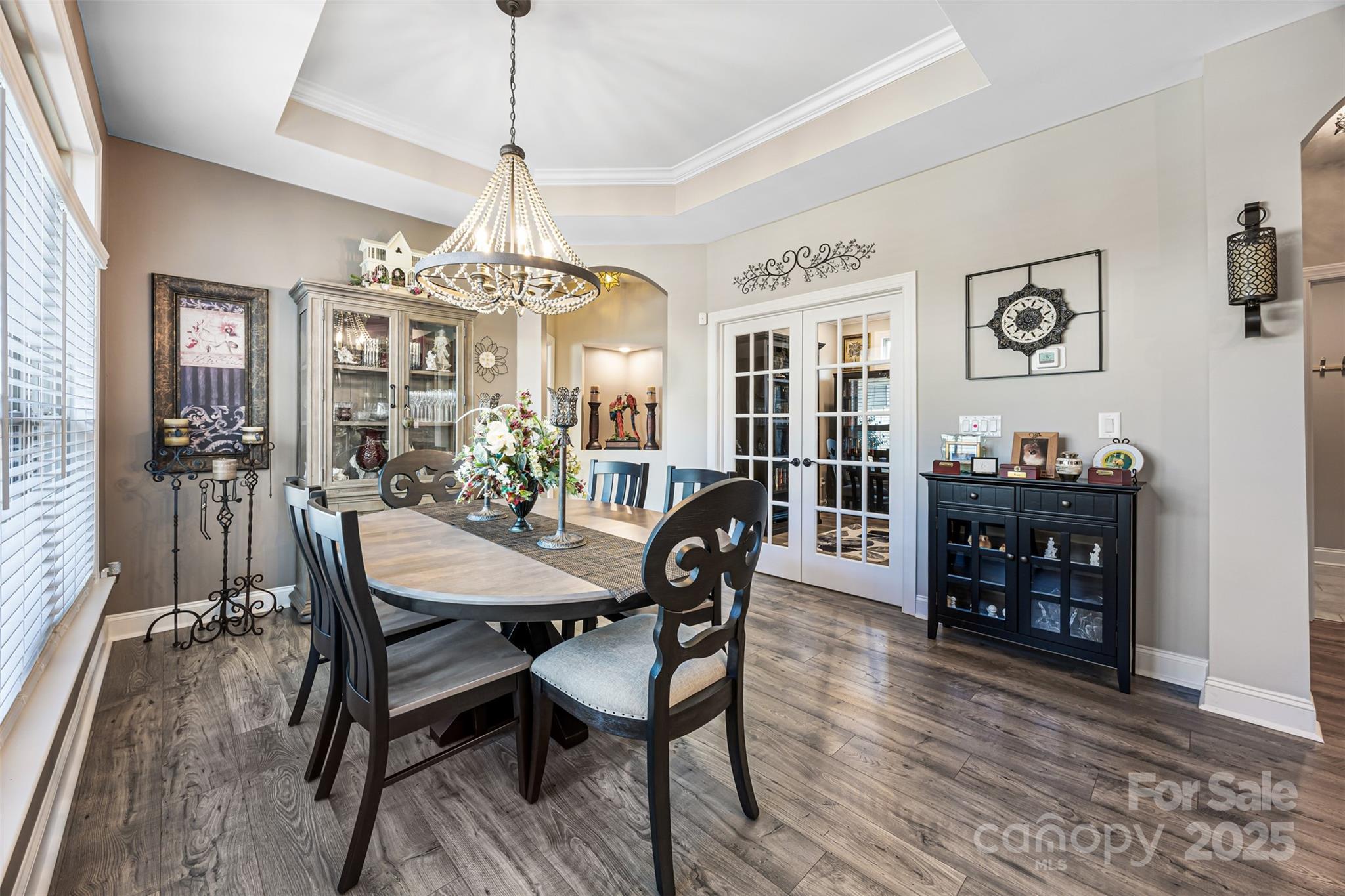16020 Clear Creek Farm Road Matthews, NC 28105 - Photo 15 of 42 a view of a dining room with furniture window and wooden floor