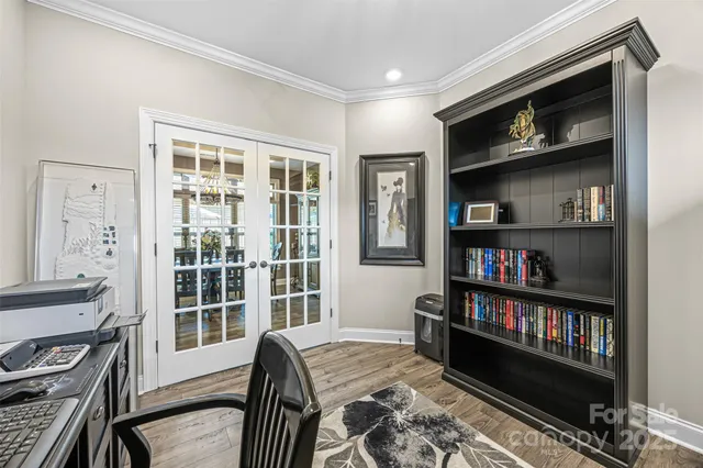 a bedroom with a bed closet and window