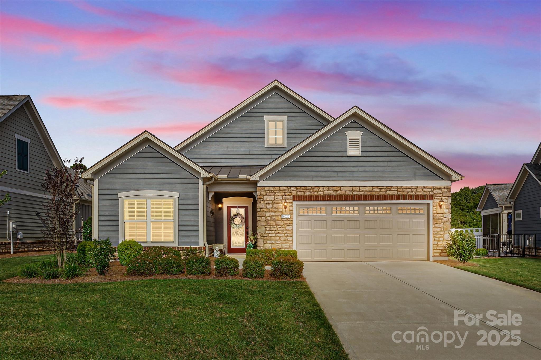 16020 Clear Creek Farm Road Matthews, NC 28105 - Photo 2 of 42 a front view of a house with a yard and garage
