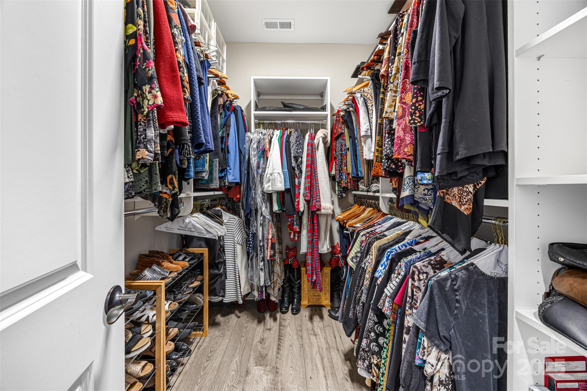 16020 Clear Creek Farm Road Matthews, NC 28105 - Photo 26 of 42 a view of walk in closet with clothes