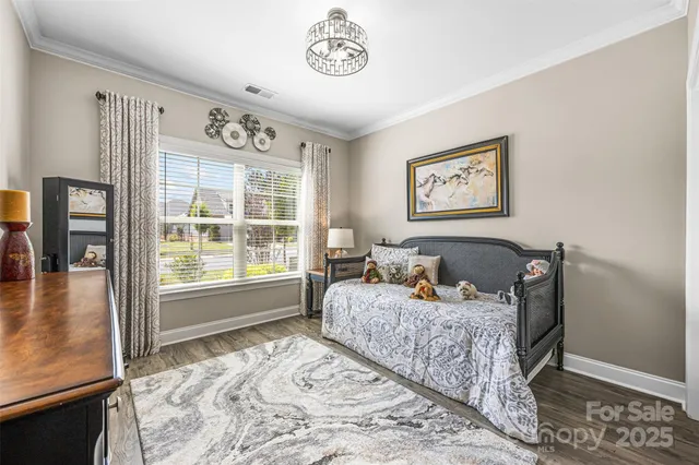 a bed room with a bed and a window