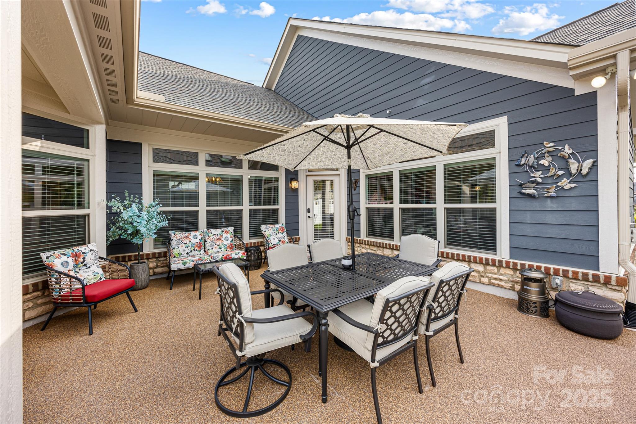 16020 Clear Creek Farm Road Matthews, NC 28105 - Photo 37 of 42 a outdoor space with patio the couches and a potted plant