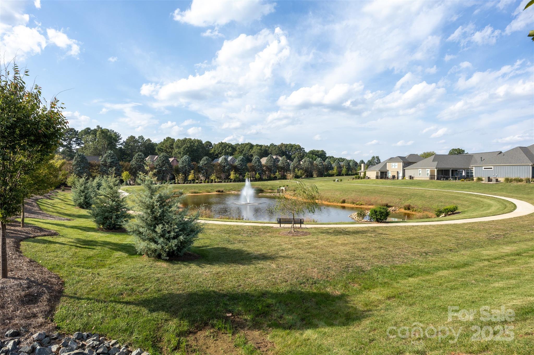 16020 Clear Creek Farm Road Matthews, NC 28105 - Photo 39 of 42 a view of a lake with houses in the back