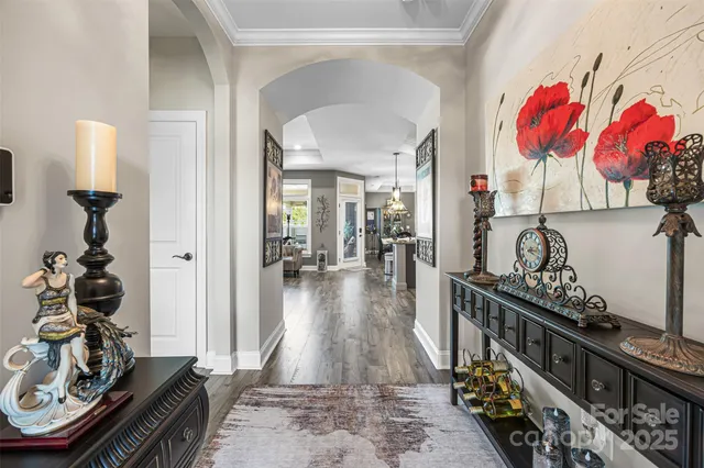 a view of a hallway with wooden floor and toys