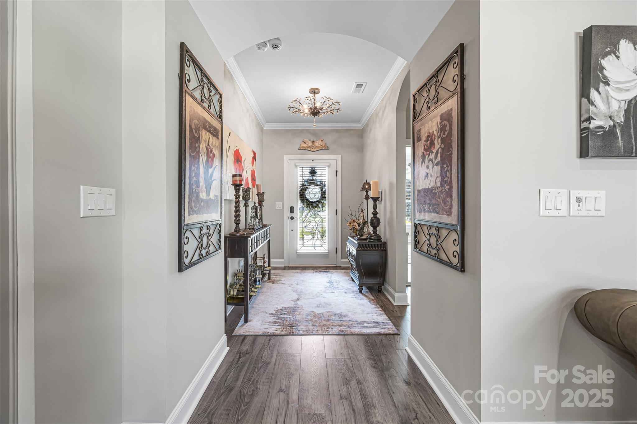 16020 Clear Creek Farm Road Matthews, NC 28105 - Photo 5 of 42 a view of a hallway view with wooden floor and living room