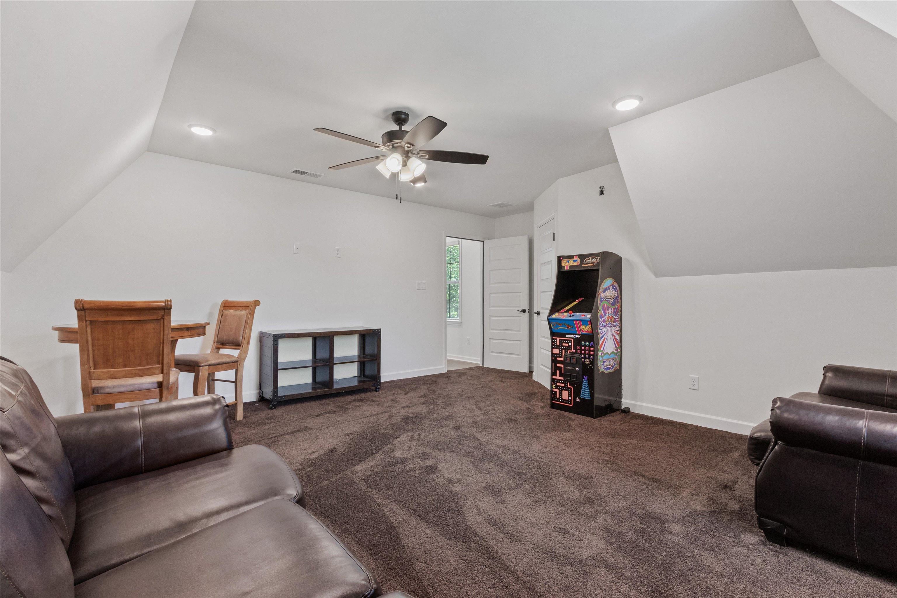 65 Watson Road Oakland, TN 38060 - Photo 29 of 40 a living room with furniture and a flat screen tv