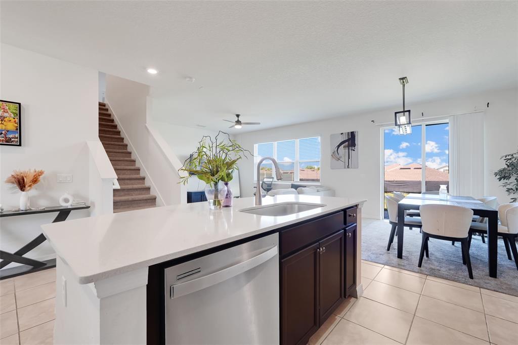 2611 Hilltop Loop Apopka, FL 32712 - Photo 12 of 46 a kitchen with a table and chairs in it
