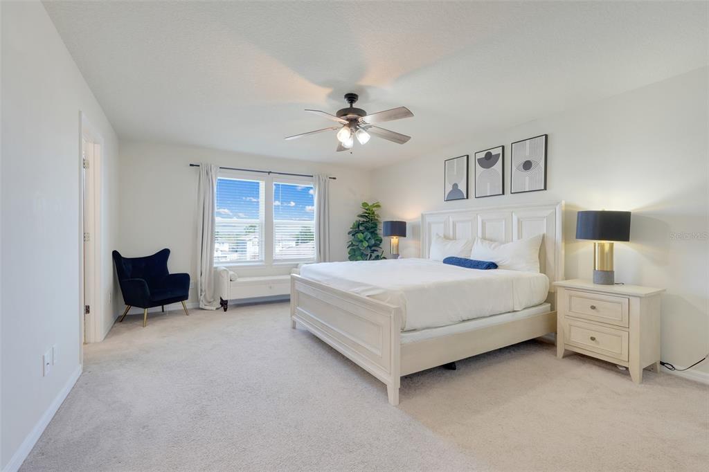 2611 Hilltop Loop Apopka, FL 32712 - Photo 21 of 46 a bedroom with a bed and a window