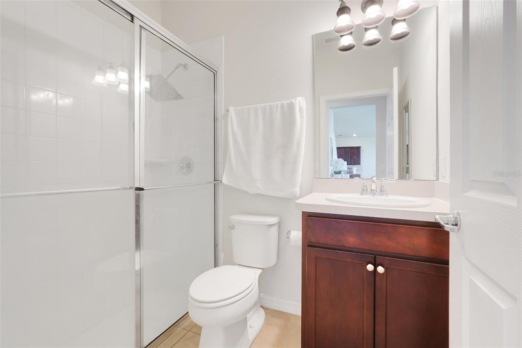 2611 Hilltop Loop Apopka, FL 32712 - Photo 35 of 46 a bathroom with a sink toilet and shower