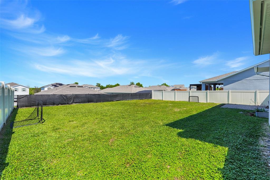 2611 Hilltop Loop Apopka, FL 32712 - Photo 36 of 46 a view of a garden with a building in the background