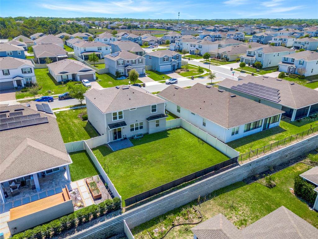 2611 Hilltop Loop Apopka, FL 32712 - Photo 42 of 46 an aerial view of a house with a big yard
