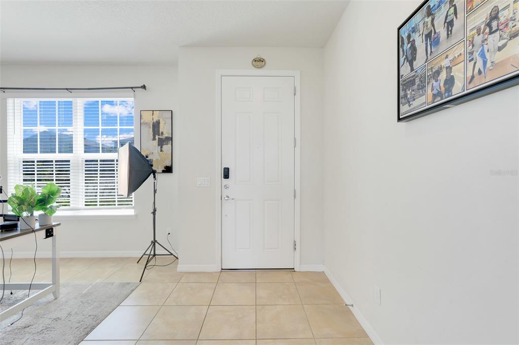 2611 Hilltop Loop Apopka, FL 32712 - Photo 8 of 46 a view of an empty room with a window