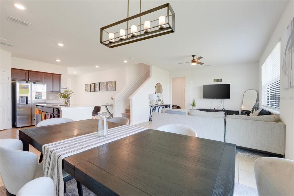 2611 Hilltop Loop Apopka, FL 32712 - Photo 9 of 46 a living room with stainless steel appliances furniture and a kitchen view