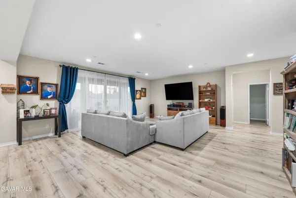 a large kitchen with a table and chairs