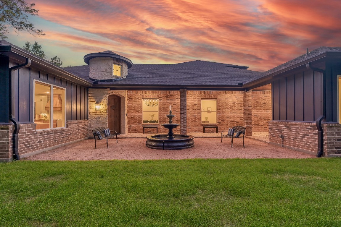 15937 Stagecoach Road Stagecoach, TX 77355 - Photo 1 of 50 a view of a backyard with table and chairs and wooden fence