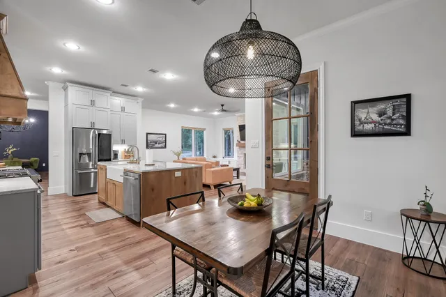 a dining room with furniture and window
