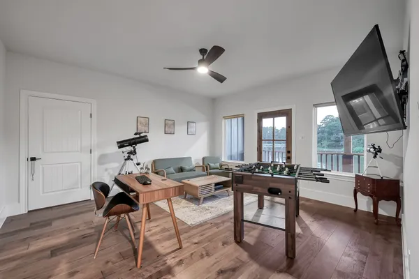 a bathroom with a granite countertop sink a toilet and shower