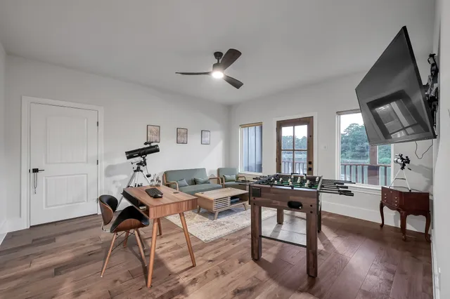 a bathroom with a granite countertop sink a toilet and shower