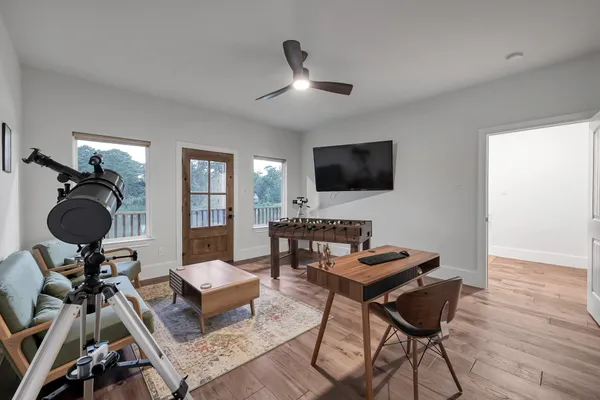 a workspace with furniture window and wooden floor