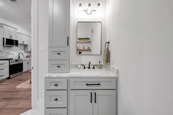 a bathroom with a toilet sink and shower