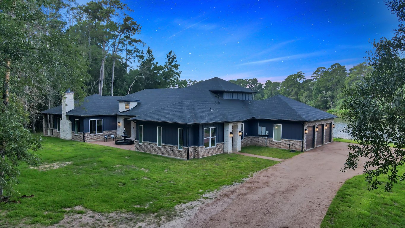 15937 Stagecoach Road Stagecoach, TX 77355 - Photo 5 of 50 a front view of a house with garden