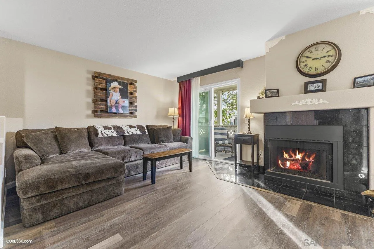 13967 Midland Road Poway, CA 92064 - Photo 5 of 37 a living room with furniture a fireplace and a large window