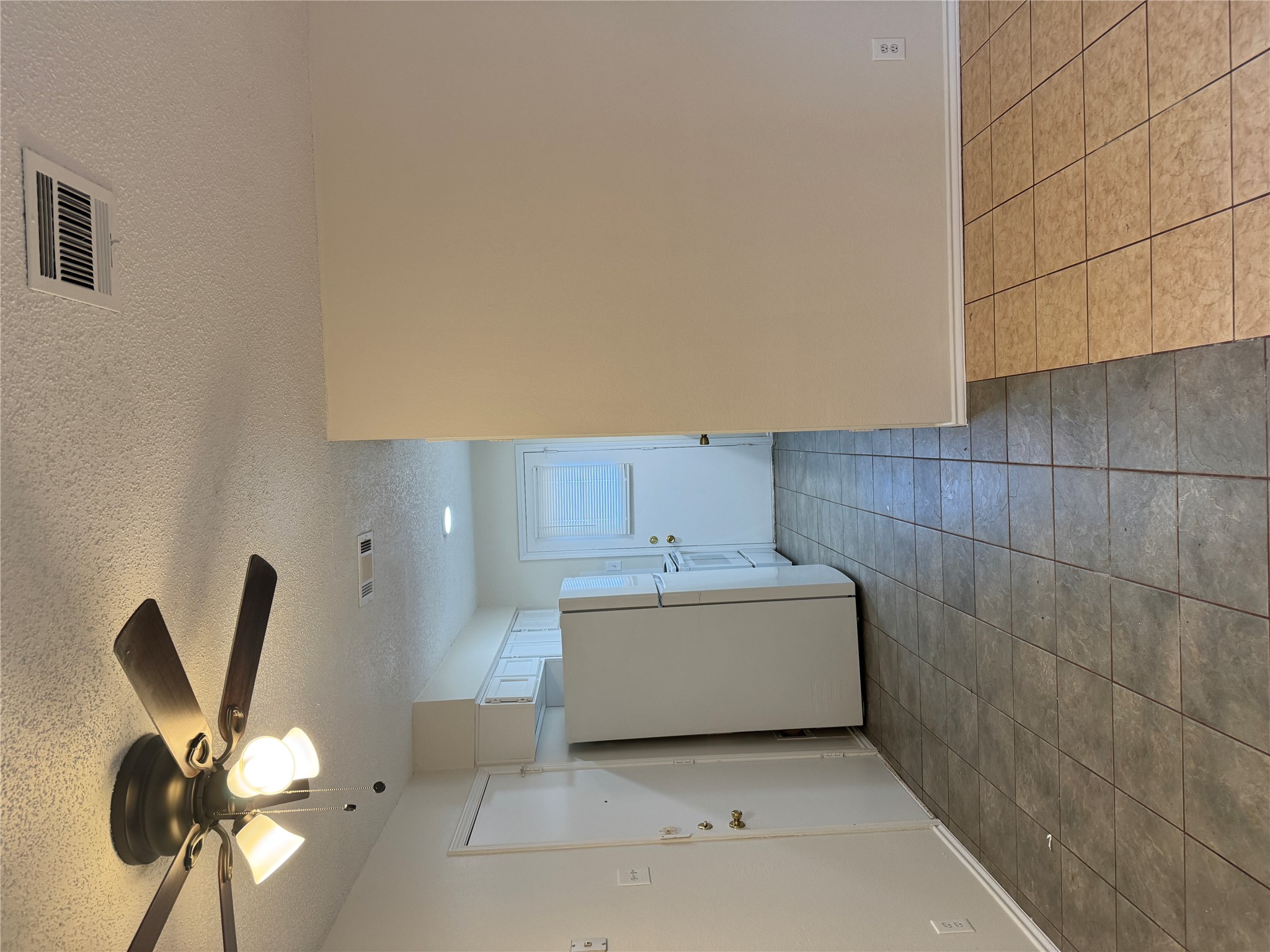 12503 Turtle Rock Road, Unit B Austin, TX 78729 - Photo 4 of 17 a view of a livingroom with an empty space