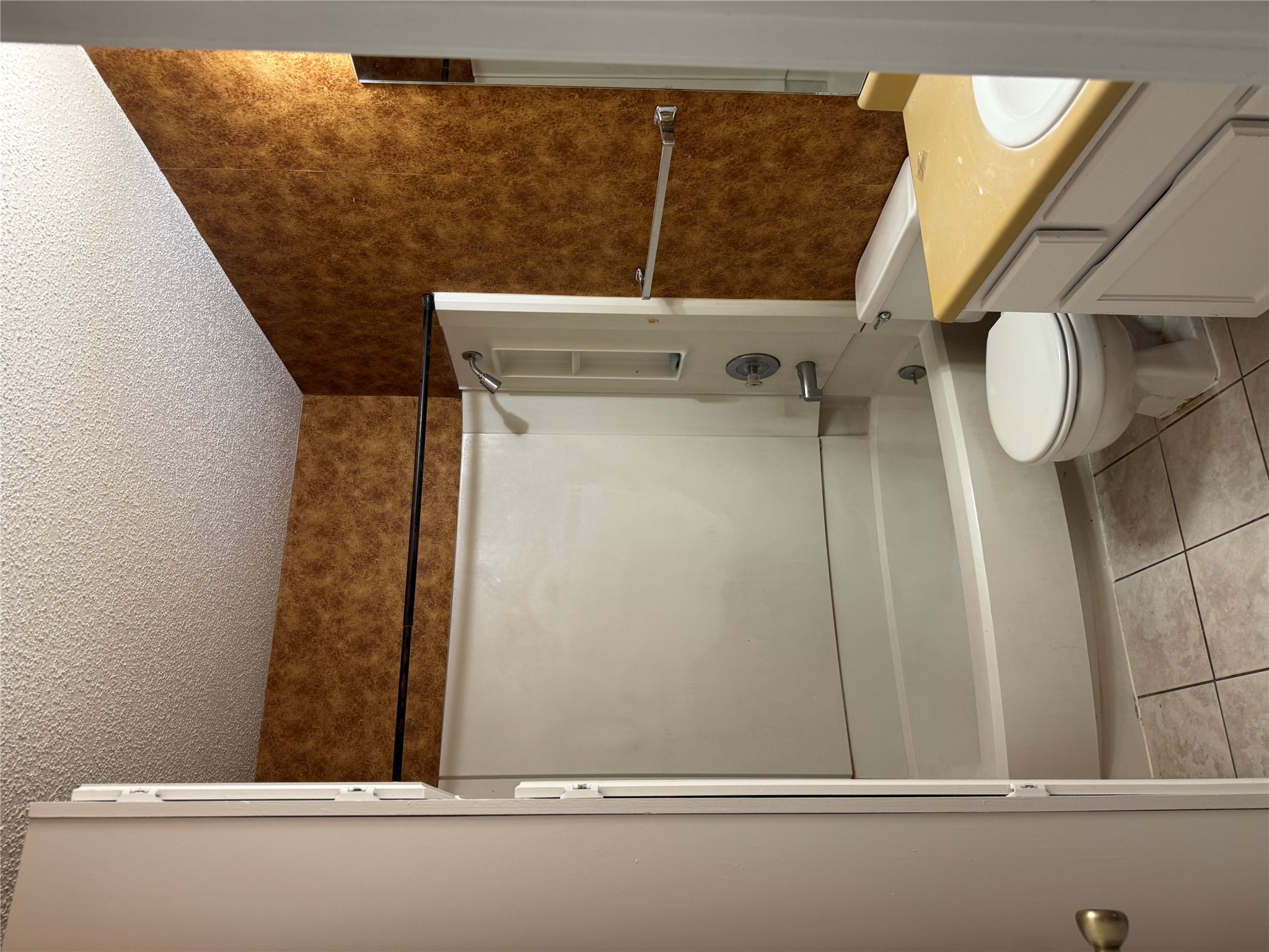 12503 Turtle Rock Road, Unit B Austin, TX 78729 - Photo 8 of 17 a bathroom with a shower and a toilet