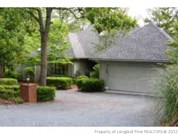 990 Burning Tree Road Pinehurst, NC 28374 - Photo 1 of 1 a view of a house with a yard and large tree