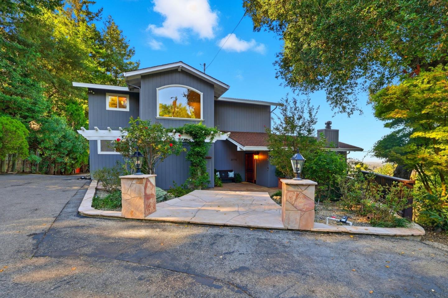 a front view of a house with a yard and a garage