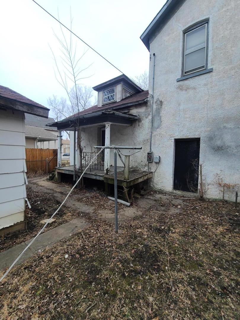 369 South 4th Avenue Kankakee, IL 60901 - Photo 3 of 15 a view of a house with a wooden fence