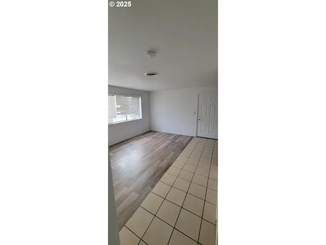 a view of an empty room with windows