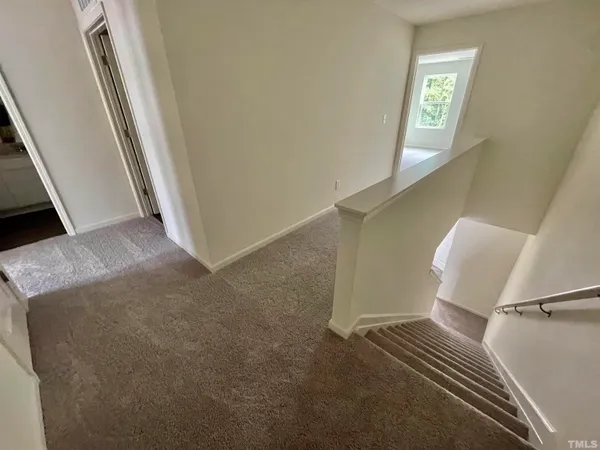 a view of a hallway with entryway