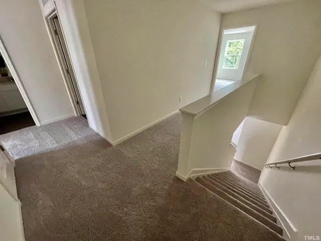 a view of a hallway with entryway