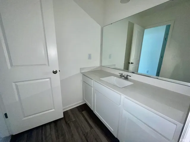 a bathroom with a sink and a mirror