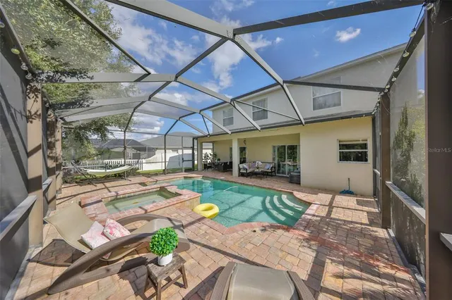 a view of outdoor space with green field and trees