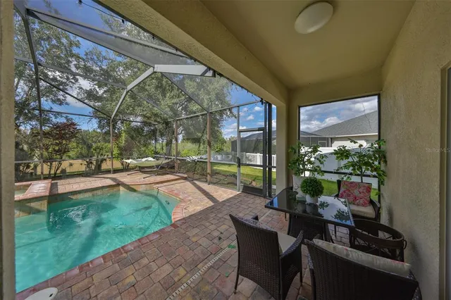 an aerial view of house with yard and lake view