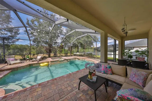 an aerial view of a house with garden space and lake view