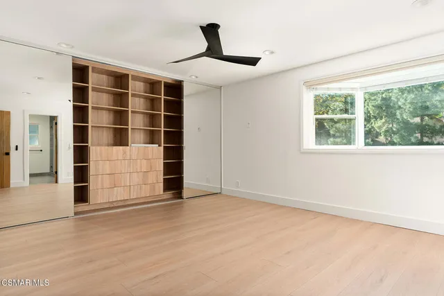 a bathroom with a sink and mirror with toilet