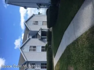 a living room with furniture and a ceiling fan
