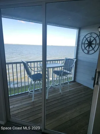 a bedroom with a bed and a ceiling fan