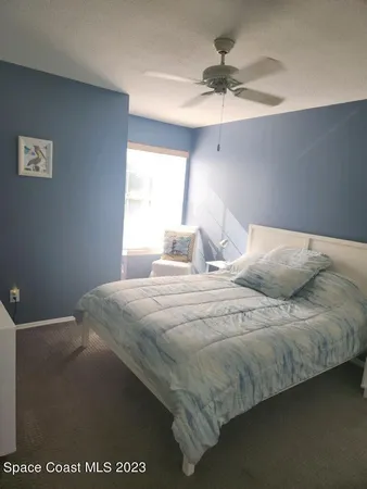 a bathroom with a sink a toilet a mirror and shower