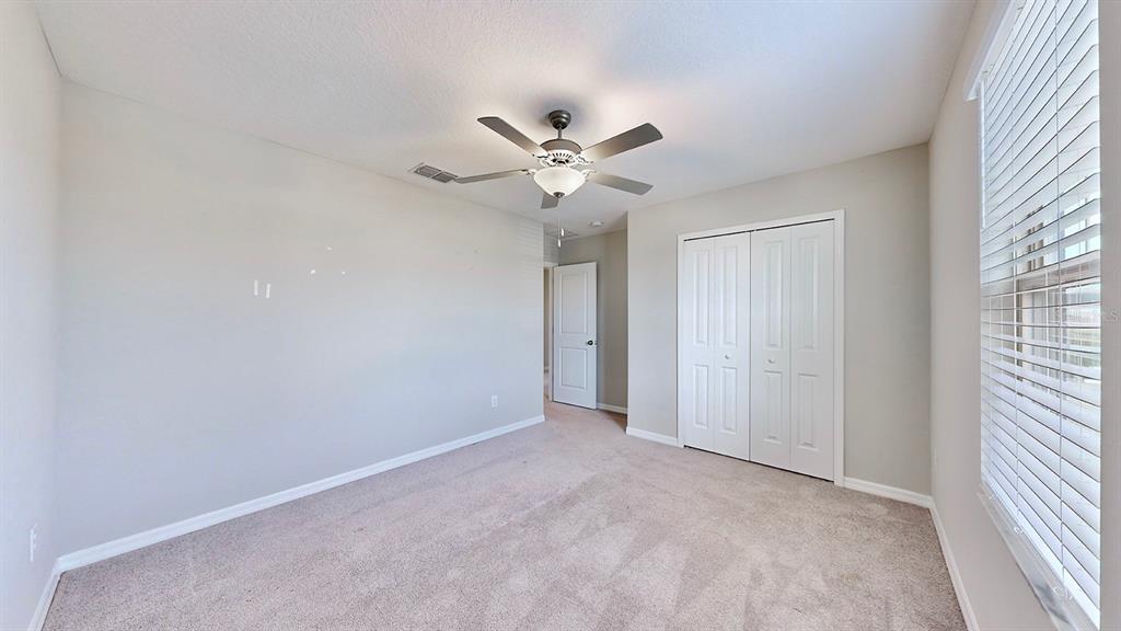 3059 Nubbin Ridge Lane Zephyrhills, FL 33540 - Photo 13 of 22 a view of an empty room