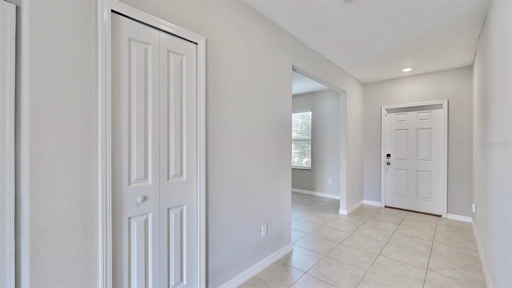 3059 Nubbin Ridge Lane Zephyrhills, FL 33540 - Photo 6 of 22 a view of entryway with bathroom